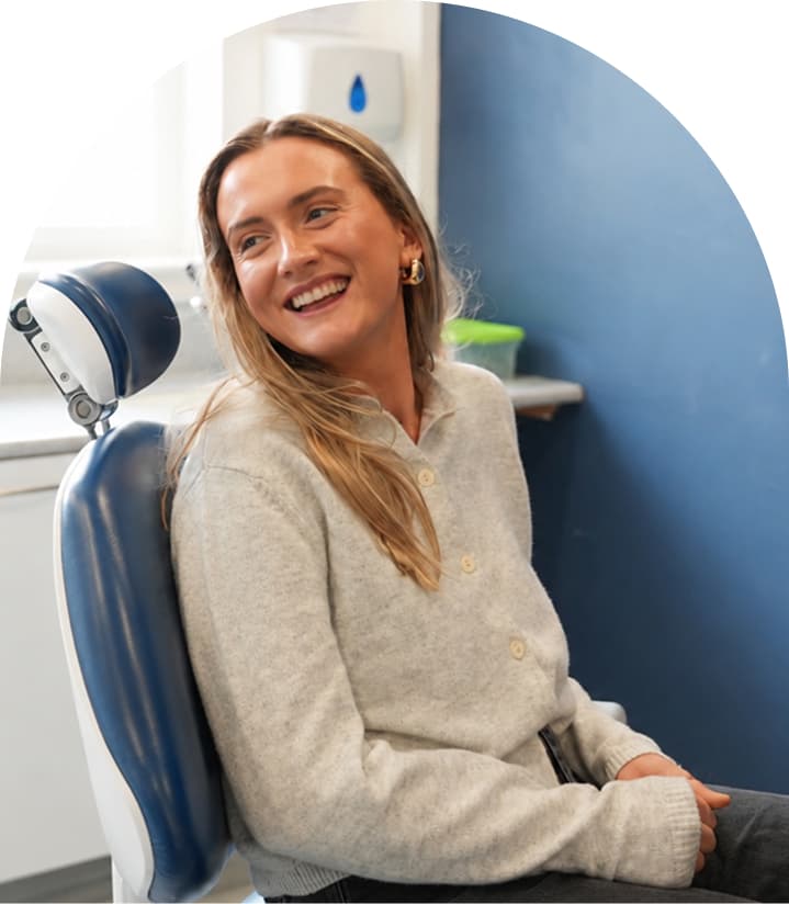 Patient sitting comfortably in a dental chair at Regent Dental